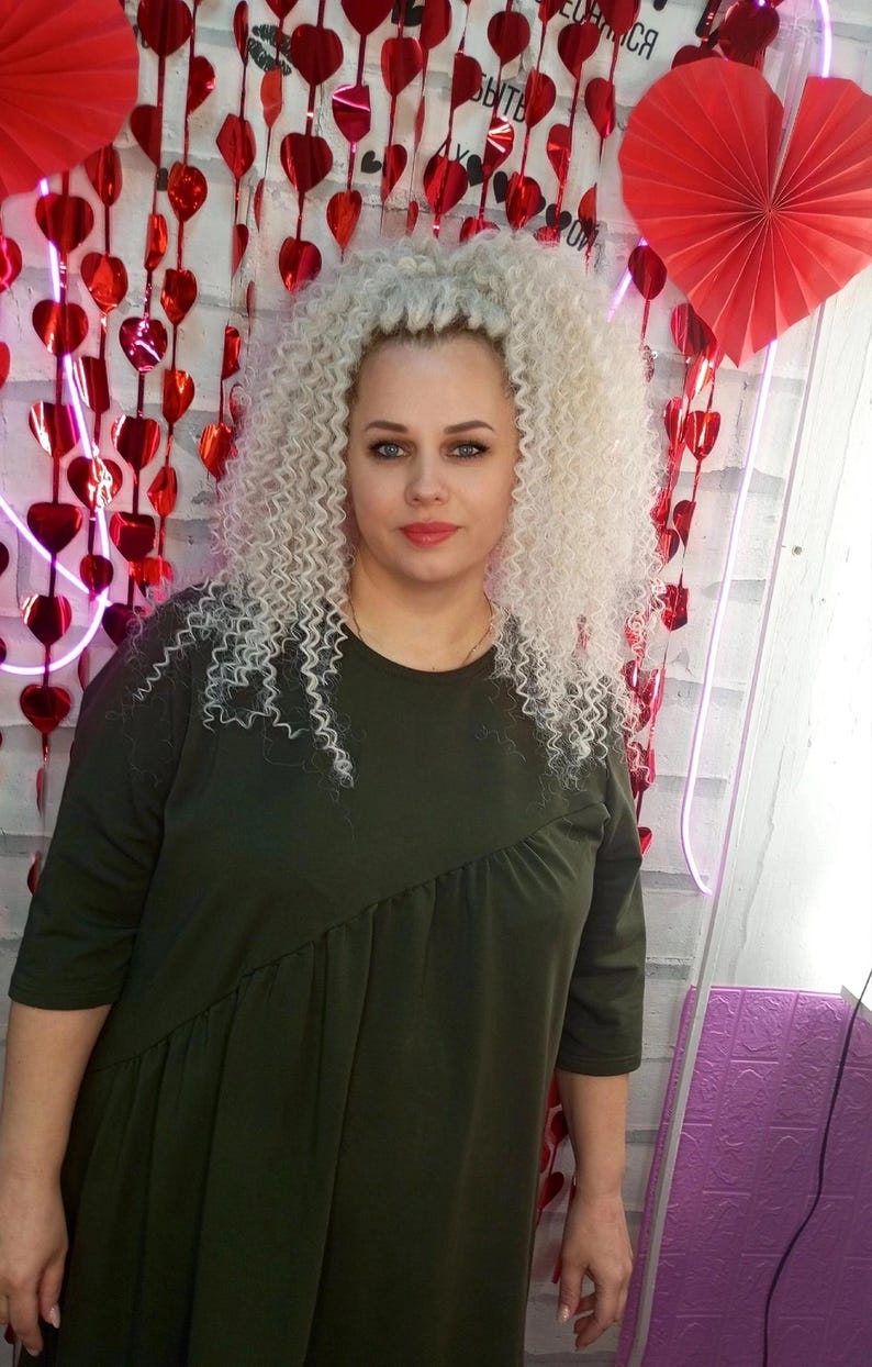 Model wearing curly blonde DE hair extensions festival style