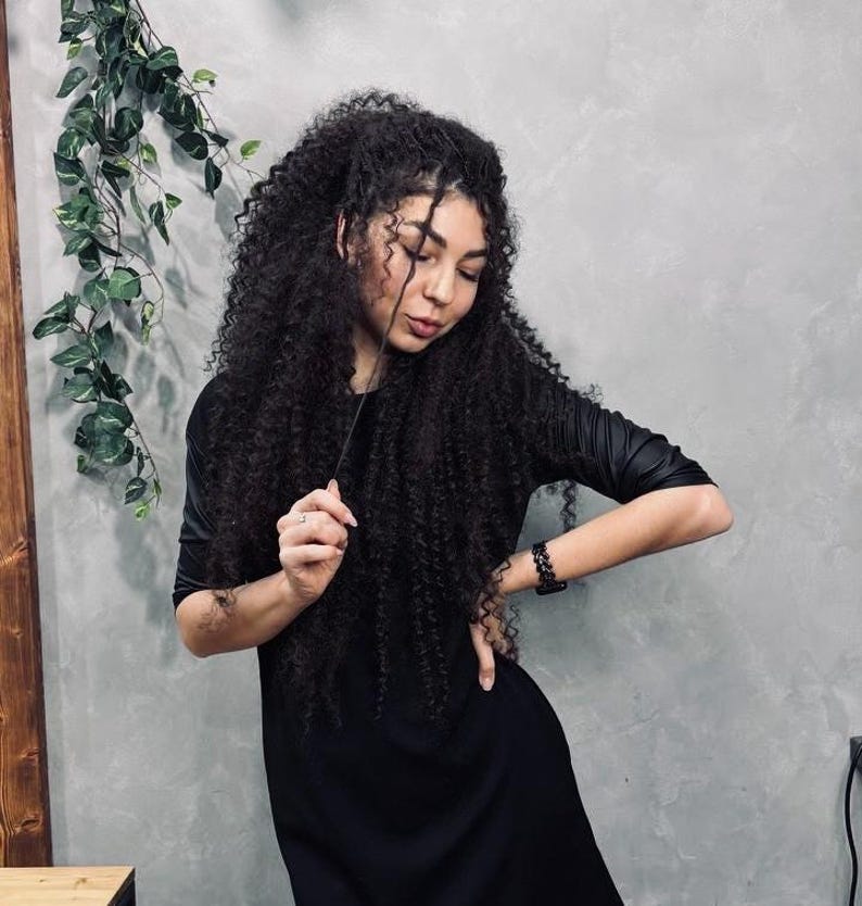 Black curly 50 DE hair set showing dense texture and volume