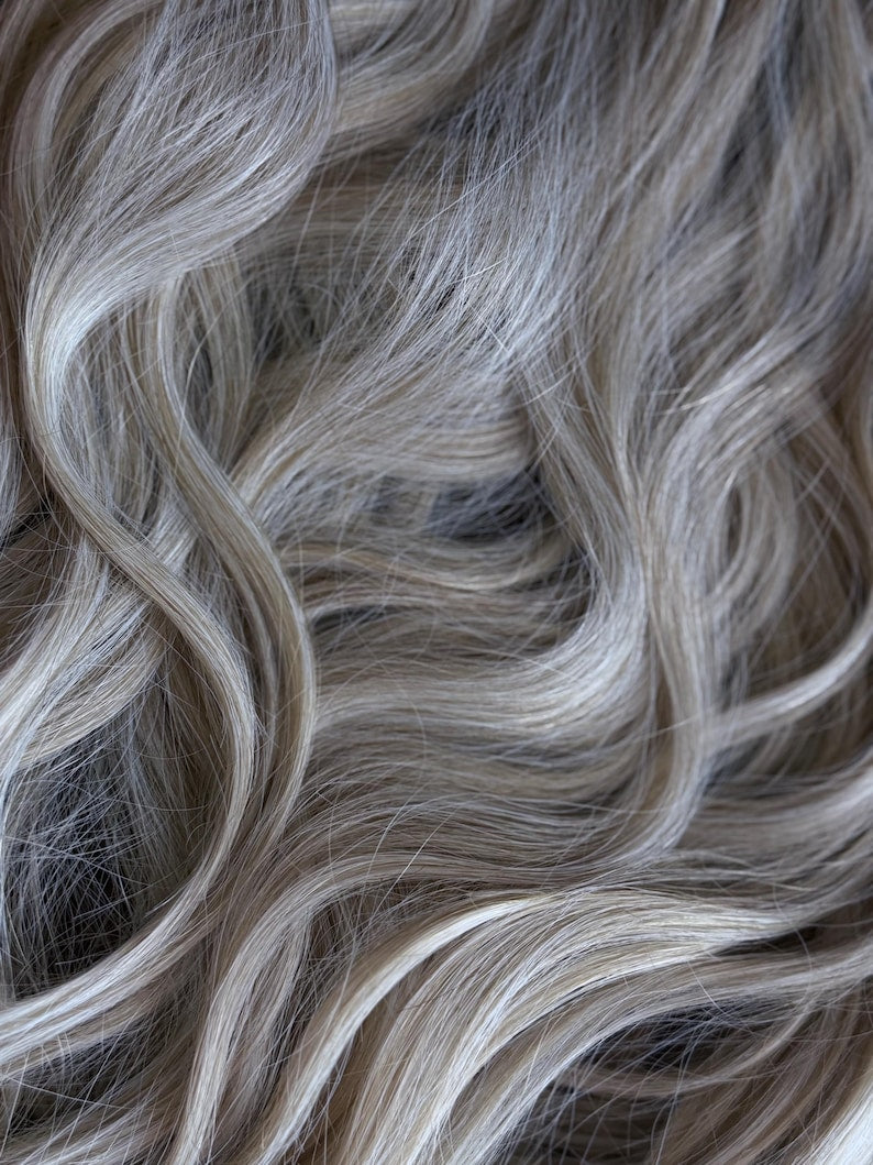 Close up of soft natural blonde wavy synthetic hair with realistic premium texture